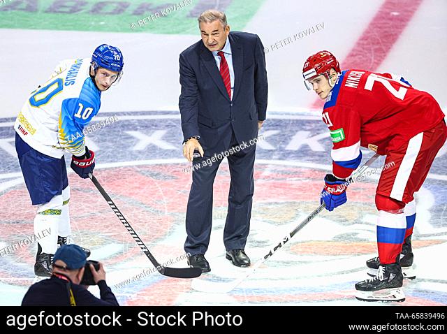 RUSSIA, ST PETERSBURG - DECEMBER 17, 2023: Kazakhstan's Nikita Mikhailis, Russian Ice Hockey Federation President Vladislav Tretiak