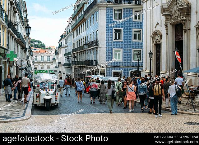 03 June 2022, Portugal, Lissabon: People stroll down the main Chiado street, Garrett Street, in downtown Lisbon. In the popular vacation destination of Portugal