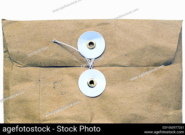 crumpled postal pocket fragment closed by thread lock isolated on white