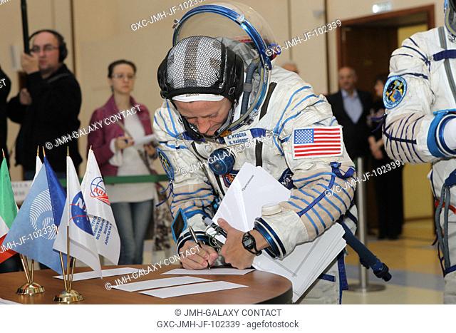 At the Gagarin Cosmonaut Training Center in Star City, Russia, Expedition 3637 Flight Engineer Karen Nyberg of NASA signs in for the start of final...