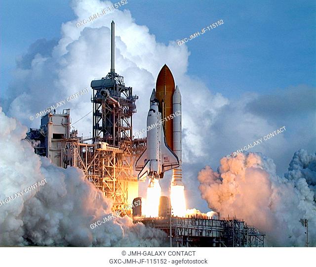 Columns of flame spew from the solid rocket boosters hurling Space Shuttle Atlantis toward space on mission STS-106. The on-time liftoff occurred at 8:45:47 a
