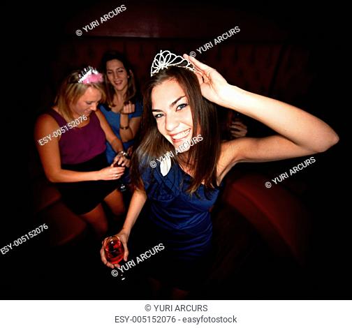 A pretty young girl out celebrating her birthday with her friends at a club