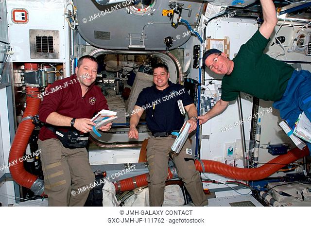 NASA astronauts Nicholas Patrick (left), Robert Behnken and Stephen Robinson, all STS-130 mission specialists, are pictured in the Harmony node of the...