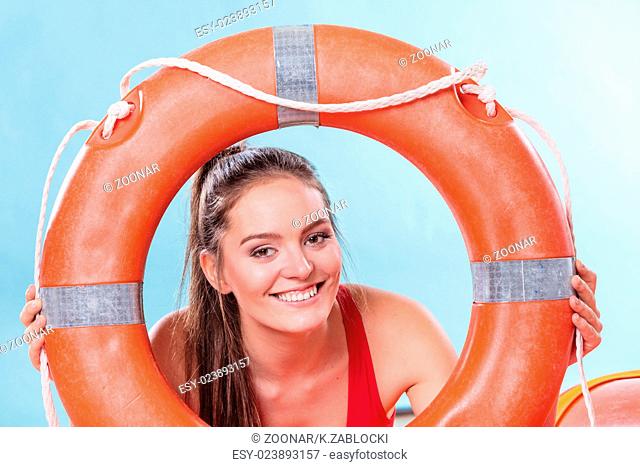 Lifeguard woman on duty with ring buoy lifebuoy