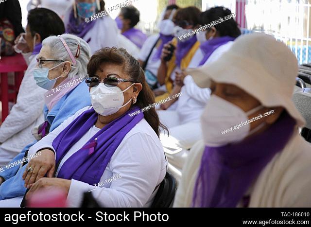 MEXICO CITY, MEXICO - MARCH 9: Women participate in a Zumba class, wearing a purple ribbon, during the strike 'A Day Without Us ' make work stoppage
