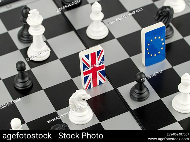 Chess pieces and flags of the European Union and the Britain on a chessboard. The concept of the political game and chess strategy Brexit