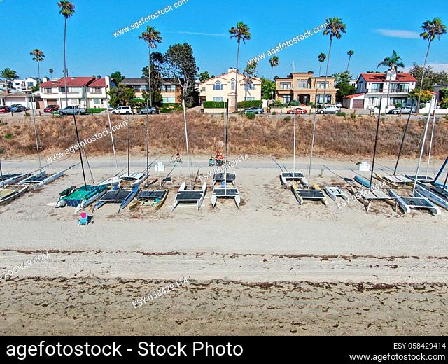 Aerial view of Mission Bay and beaches with sailboat in San Diego, California. USA. Community built on a sandbar with villas and recreational Mission Bay Park