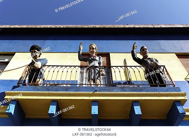 Carlos Gardel, Diego Maradonna, Evita Peron on balcony in La Boca, Buenos Aires, Argentina