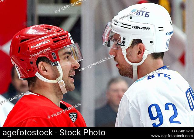 RUSSIA, MOSCOW - NOVEMBER 14, 2023: Spartak's Shane Prince (L) and Dynamo's Igor Ozhiganov in a 2023/24 KHL Regular Season ice hockey match between Spartak...