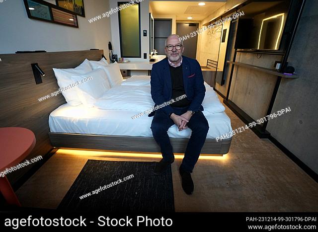 14 December 2023, Hamburg: Marek N. Riegger, Managing Director of RIMC Hotels & Resorts, sits in a sample standard room in the ""Reverb by Hard Rock Hotel"" on...
