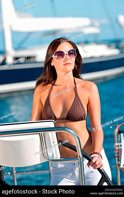 Young woman sailing on yacht