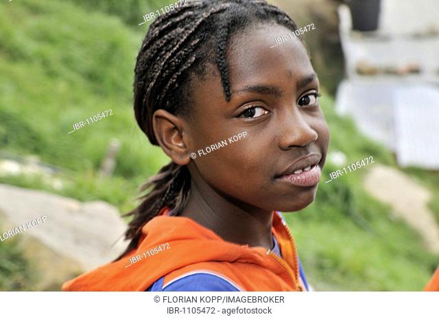 Eleven year old dark-skinned girl, slums of Alto de Cazuca, Soacha, Bogotá, Columbia