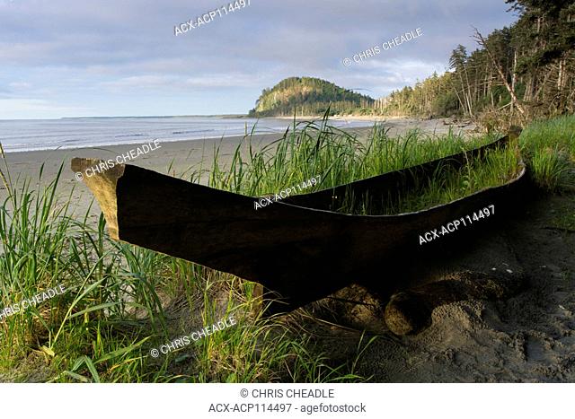 Haida dugout cedar canoe on Agate Beach, with Tow Hill shown, Haida Gwaii, formerly known as Queen Charlotte Islands, British Columbia, Canada