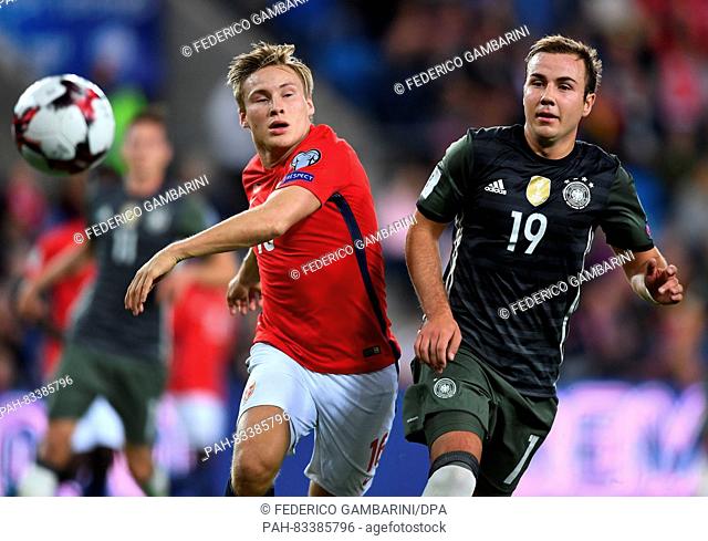 Mario Goetze (R) of Germany and Jonas Svensson of Norway in action during the FIFA World Cup Qualifiers Europe Group C soccer match between Norway and Germany...