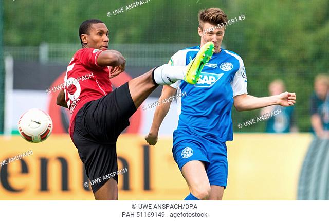 Walldorf's Nicolai Gross (R) and Hanover's Marcelo in action during the DFB Cup first round match between FC Astoria Walldorf and Hannover 96 at FC Astoria...