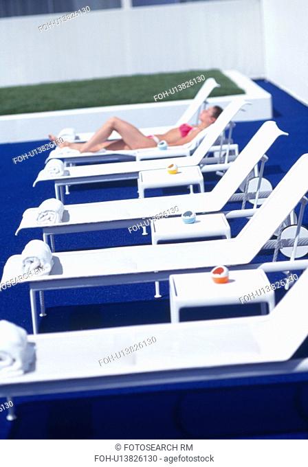 Modern white loungers on blue terrace of The Standard Hotel in Los Angeles