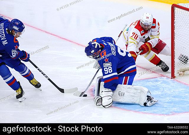 RUSSIA, ST PETERSBURG - OCTOBER 9, 2023: HC SKA St Petersburg's Maxim Fedotov, goaltender Nikita Serebryakov and HC Kunlun Red Star Beijing's Luke Lockhart...