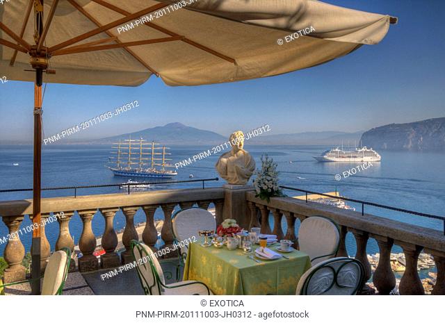Bust on the balcony of a terrace with the sea in the background, Sorrento, Campania, Italy