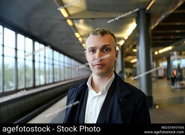 Businessman at railroad station platform
