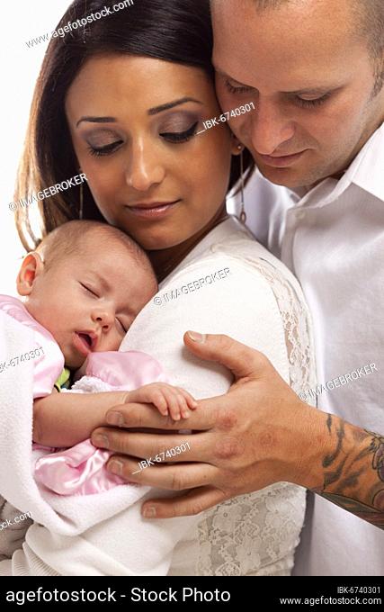 Happy young attractive mixed-race family with newborn baby