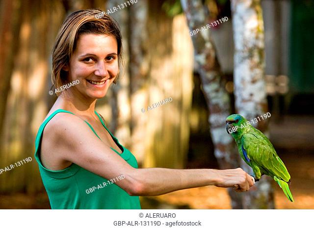 Woman Holding Parrot, Jaraqui Community, Negro River, Manaus, Amazônia, Amazonas, Brazil