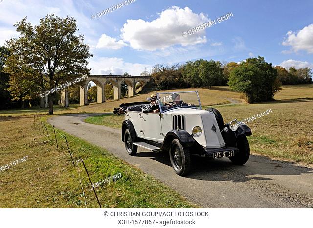 drive with an open touring vintage car Renault 1925 around Auch Gers department, Midi-Pyrenees, southwest of France, Europe