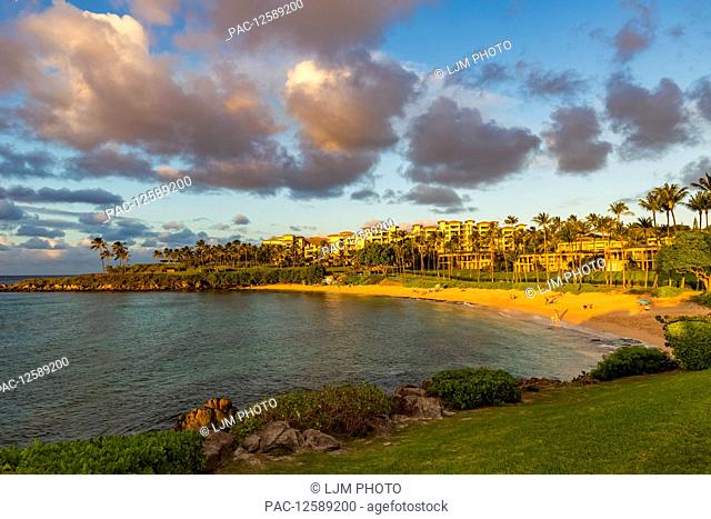 Tourists enjoying Kapalua Beach at sunset; Ka'anapali, Maui, Hawaii, United States of America