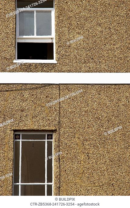 Pebble dash facade of a suburban house, London, UK