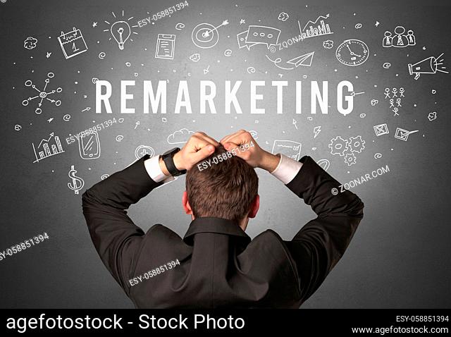 Rear view of a businessman with REMARKETING inscription, modern business concept