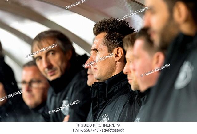 Germany's coach trainee Miroslav Klose (4.f.R) stands with the supporting staff during the World Cup qualifier match between San Marino and Germany in...