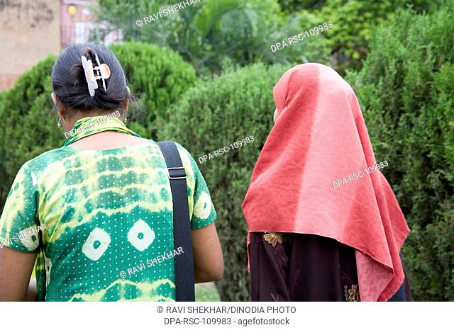 Muslim women  walking  ; Lalbag fort ; Dhaka ; Bangladesh