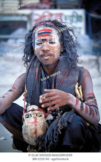 Young Sadhu with a human skull hanging around his neck, Kumbh or Kumbha Mela, Haridwar, Uttarkhand, formerly Uttaranchal, Indian Himalayas, North India, India