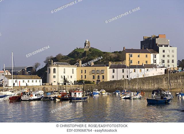 UK, Wales, Pembrokeshire, Tenby, colourful buildings around the harbour in autumn sunshine