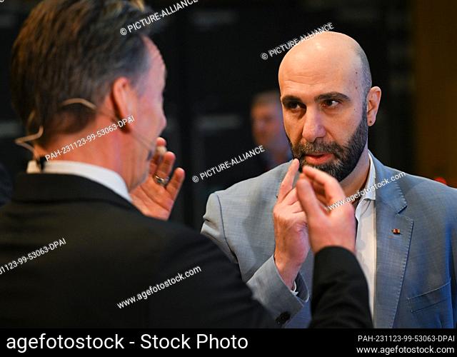 23 November 2023, Hesse, Wiesbaden: Ahmad Mansour (r), extremism researcher, author and psychologist, and Holger Münch, President of the Federal Criminal Police...