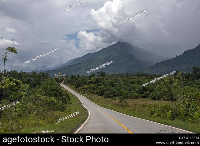 Aruk road scenes, West Kalimantan, Indonesia Aruk road scenes in West Kalimantan, Indonesia, can include picturesque views of rolling hills, lush forests