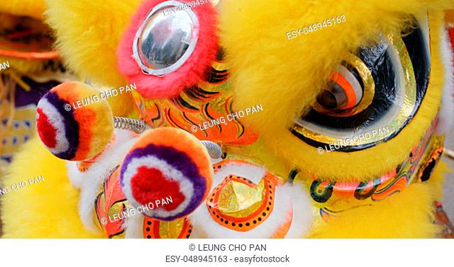 Chinese lion dance in yellow