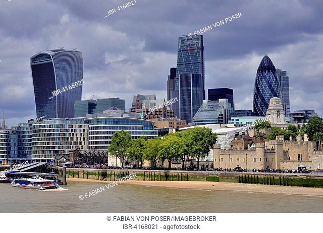 Skyline of the financial district, City of London, Tower of London on the right, The Gherkin behind, London, England, United Kingdom