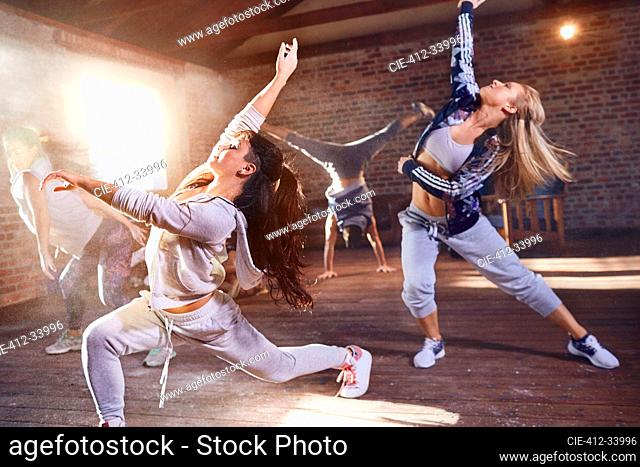 Young hip hop dancers with powder dancing in studio