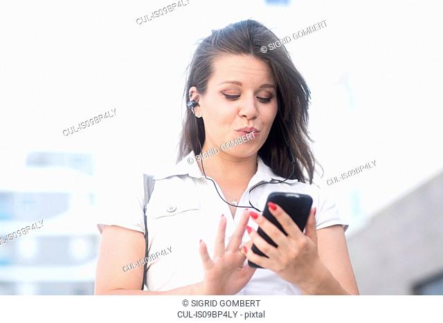 Woman texting on smartphone