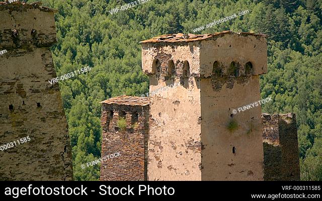 Zoom out from close up of stone medieval fortified Svaneti tower houses of Murkmeli, near Ushguli, Upper Svaneti, Samegrelo-Zemo Svaneti, Mestia, Georgia