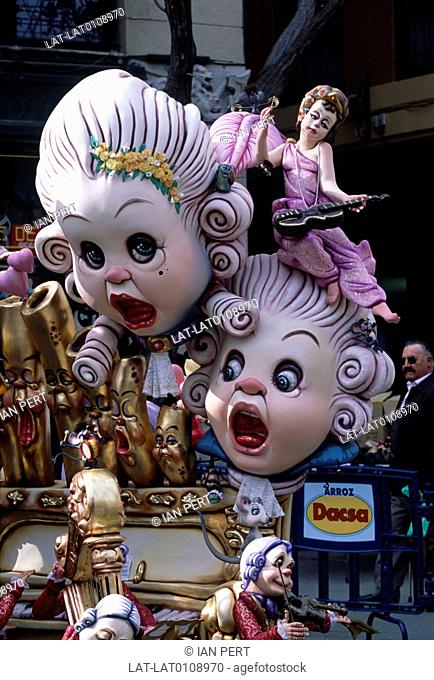 Fallas. Annual street festival. 13 to 19 March. Papier mache figures on floats. Giant heads. Ninots
