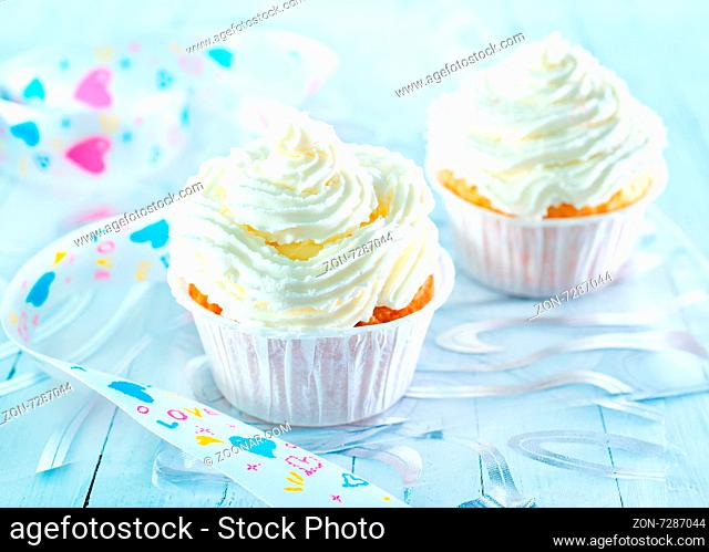 cupcuke with white cream on a table