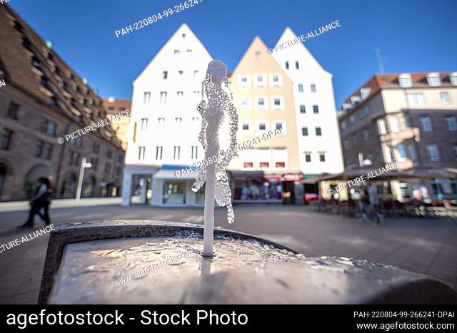 03 August 2022, Bavaria, Nuremberg: Water rises from drinking fountains in the city center. In Bavaria, too, heat is increasingly becoming a health risk