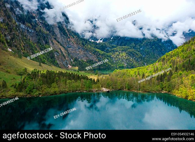 Scenic mountain panorama with green meadows and idyllic turquoise Lake Oberer Gaisalpsee on the hike to Nebelhorn Mountain, Oberstdorf, Bavaria, Germany
