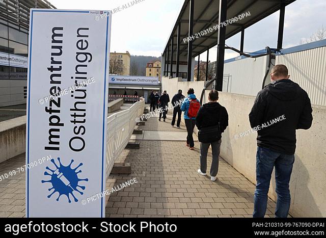 10 March 2021, Thuringia, Gera: Patients wait at the entrance at the opening of the supraregional vaccination center Gera