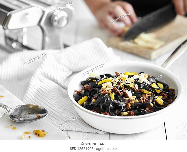Black pasta with sun-dried vegetables