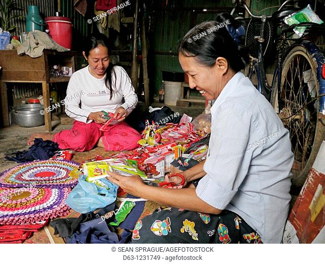CAMBODIA    Eam Sim left, 50 and Van Srey, 46, who work together to make bags from recycled plastic and cushions from recycled cloth  They were trained by CSARO...