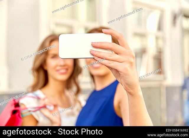 happy women taking selfie with smartphone