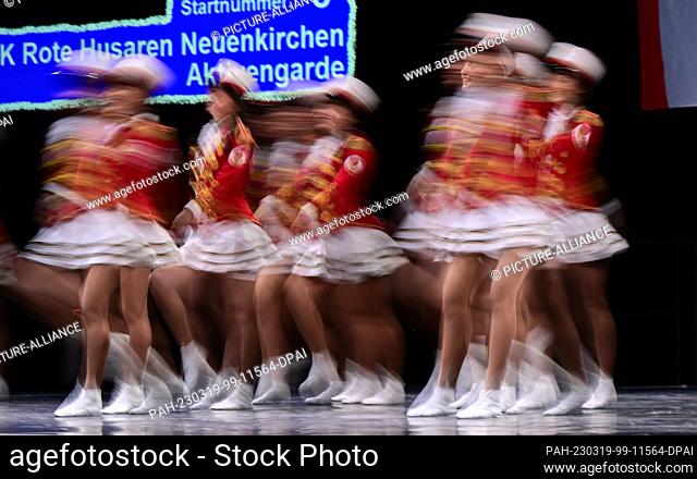 19 March 2023, Baden-Württemberg, Stuttgart: The ladies of the dance corps Rote Husaren Aktivengarde dance at the German Carnival Dance Championships in the...