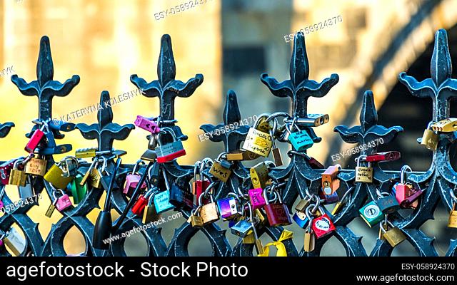 PRAGUE, CZECH REPUBLIC - July 31, 2018: Padlocks, locked to railings on Charles Bridge in Prague